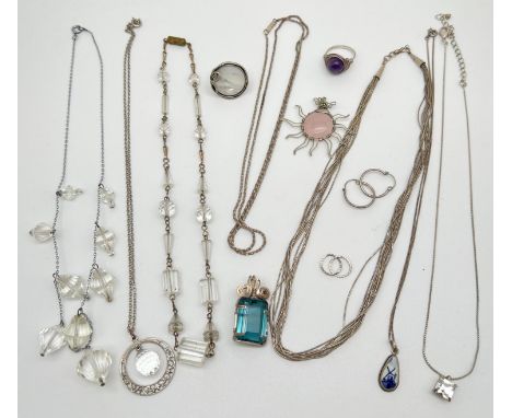 A collection of silver and white metal jewellery items to include necklaces, rings and earrings. Lot includes: 2 pairs of hal