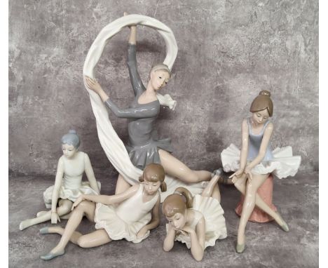 A Nao figure, of a ballerina with ribbon, 34cm high, a ballerina seated; other ballerinas 