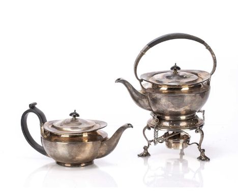 Three piece silver tea set consisting of a teapot with ebonised handle, and a kettle on stand (with burner) bearing marks for