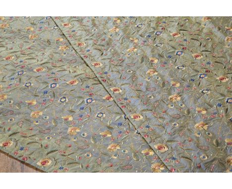 Pair of silk embroidered curtains decorated with flowers, worked in coloured threads on a green/blue ground, lined, each curt
