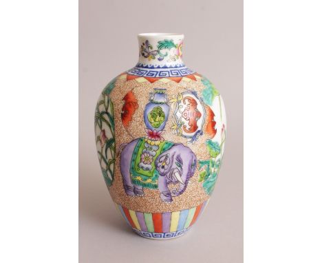 A CHINESE FAMILLE ROSE PORCELAIN VASE, decorated with elephants and with panels of lotus, the base with a Qianlong seal mark,