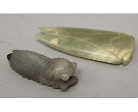 TWO CHINESE JADE CARVINGS OF CICADA, one a pendant, 2in & 2.9in long. (2)