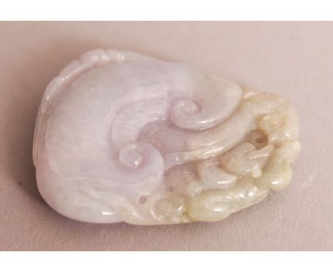 A CHINESE WHITE & CELADON GREEN JADE PENDANT, pierced and decorated in relief with ruyi and a chilong, 1.3in wide at widest p