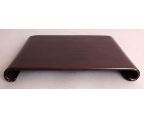A 19TH/20TH CENTURY CHINESE SHALLOW RECTANGULAR HARDWOOD STAND, with scroll ends, 11.3in wide & 1.4in high.