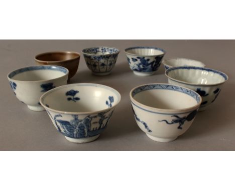 A GROUP OF EIGHT VARIOUS CHINESE KANGXI PERIOD SHIPWRECK PORCELAIN TEABOWLS, mostly blue and white, various designs and sizes