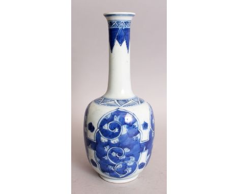 A CHINESE BLUE & WHITE PORCELAIN BOTTLE VASE, decorated with stylised ruyi scroll panels, 8.3in high.