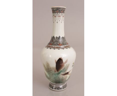 A SMALL CHINESE REPUBLIC STYLE PORCELAIN VASE, unusually decorated with a carp leaping from water weeds, the base with a seal