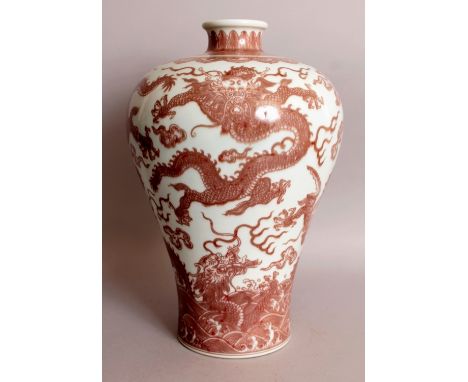 A LARGE CHINESE MING STYLE COPPER RED PORCELAIN MEIPING VASE, decorated with sinuous dragons amidst flame and cloud scrolls a