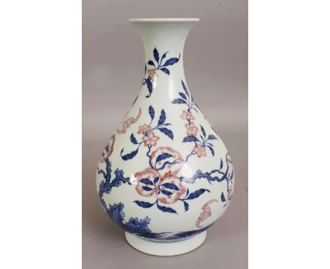 A CHINESE UNDERGLAZE-BLUE & COPPER-RED PORCELAIN VASE, of yuhuchun form, the pear-form body decorated with bats and extended 