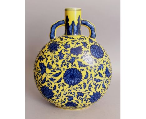 A CHINESE MING STYLE YELLOW GROUND BLUE & WHITE PORCELAIN MOON FLASK, decorated with a formal design of scrolling flowerheads