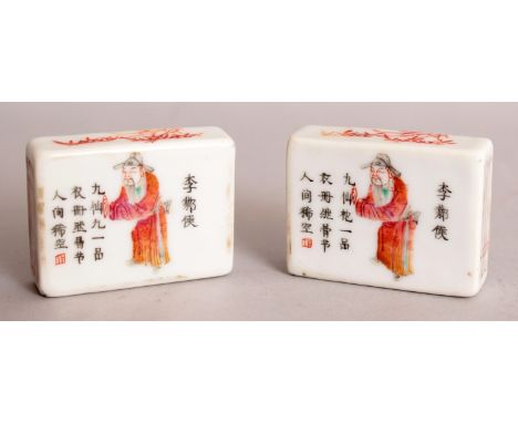 AN UNUSUAL PAIR OF LATE 19TH CENTURY CHINESE FAMILLE ROSE PORCELAIN RECTANGULAR SCROLL WEIGHTS, each upper surface painted wi