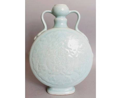 A CHINESE MOULDED CELADON PORCELAIN MOON FLASK, each domed surface decorated with twin fish, lotus and an auspicious characte