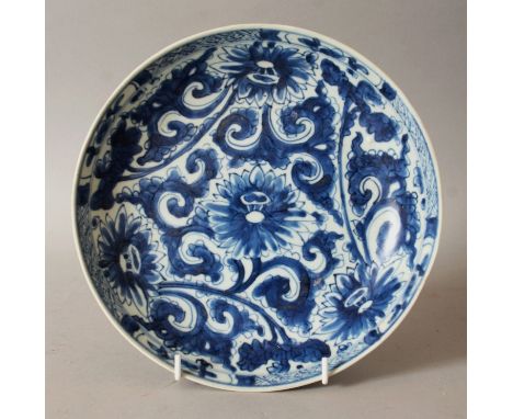 A CHINESE KANGXI PERIOD BLUE & WHITE SHIPWRECK PORCELAIN PLATE, circa 1700, of saucer shape, the interior painted in a vivid 