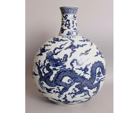 A LARGE CHINESE MING STYLE BLUE & WHITE DRAGON MOON FLASK, each domed surface decorated with a dragon amidst flames and cloud