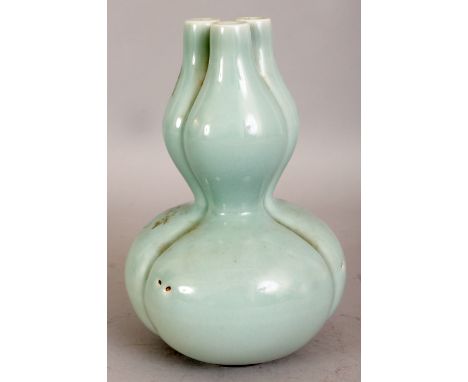 A CHINESE DOUBLE GOURD CELADON PORCELAIN VASE, with an unusual triple neck, the sides lobed, the base with a Qianlong seal ma