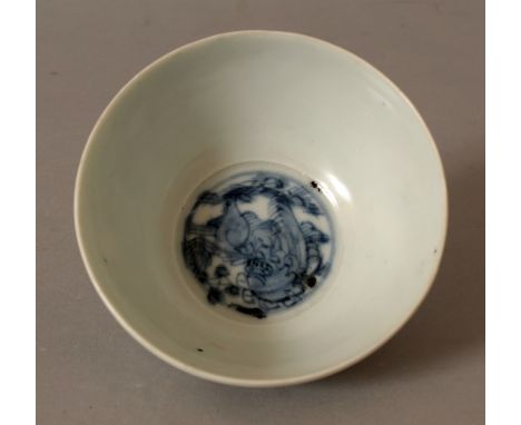 A CHINESE WANLI PERIOD BLUE & WHITE SHIPWRECK PORCELAIN BOWL, painted to its centre with a circular panel of a Buddhistic lio