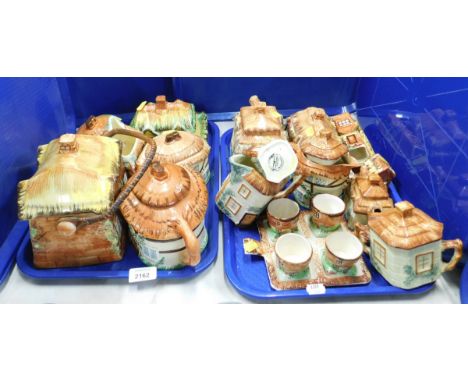 Various cottageware ceramic, to include teapots, jars and covers, biscuit barrels, etc. (2 trays) 