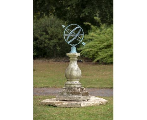 Sundials: A carved Cotswold stone sundial pedestal on octagonal surround with later copper armillary sphere, 176cm highThe Co