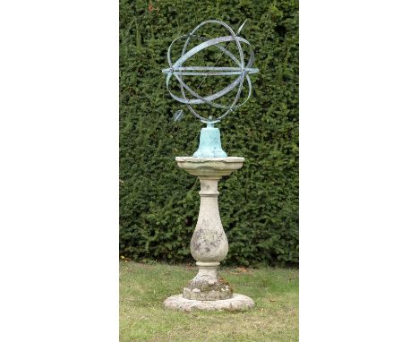 Sundials: A carved Cotswold stone sundial pedestal, 2nd half 19th century, on cushion base and with later armillary, 194cm hi