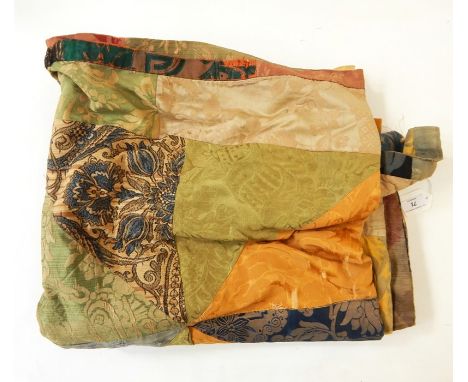 Patchwork throw quilt made out of furnishing damasks, a needlework specimen book with specimens, dated 1905-7 belonging to Ma