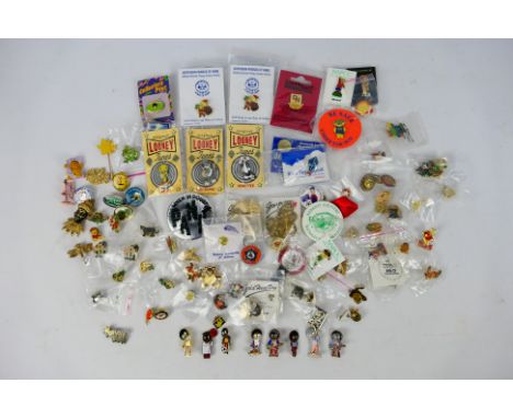A collection of pin badges to include vintage Robertsons advertising enamel examples. [W]These items are listed on the basis 