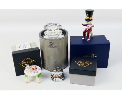 Three boxed Dubarry Porcelain Alice's Adventures In Wonderland themed items comprising Mad Hatter trinket box, tea table and 