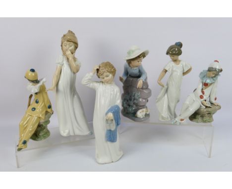 A quantity of Spanish porcelain figures by Nao, including two Pierrot / clown musician figures, largest approximately 28 cm (
