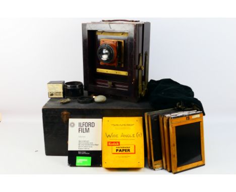 A vintage Kodak View Camera Model B maroon red coloured. Comes with a Ross, London number 84623, 7.25", 1:4.5 Xpres lens. Als