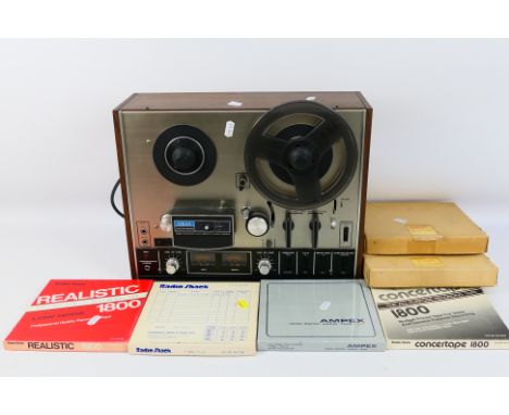 An Akai reel to reel player / recorder, model 4000DS with a quantity of tape reels. [W]
