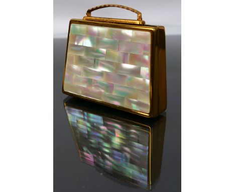 A mid-century Mascot ASB pearl lid musical powder compact. Musical notes when key is turned. Built in mirror. Powder Compact 