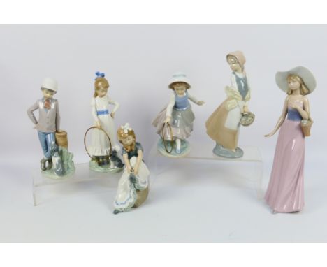 A quantity of Spanish porcelain figures by Nao, largest approximately 32 cm (h). [W]