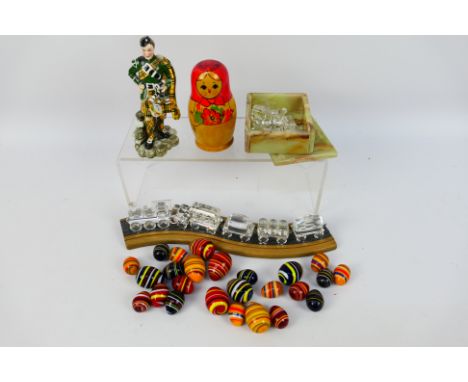 A mixed lot to include Swarovski and similar ornaments, a ceramic Piper figure, Russian nesting dolls and other. [W]
