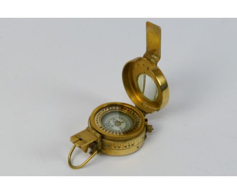 A brass cased prismatic compass. [W]