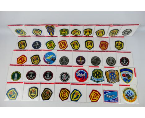 Approximately forty cloth squadron and similar patches, each contained in an individual pouch with annotated details, purchas