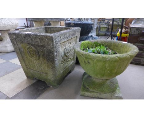 A concrete garden planter and a concrete urn 