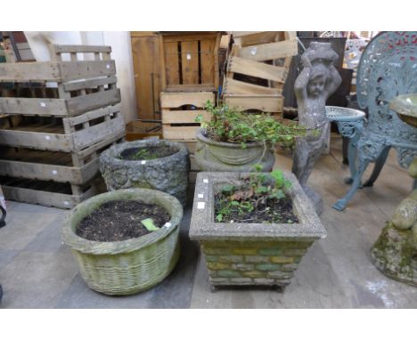 Four concrete garden planters and a concrete garden figure 