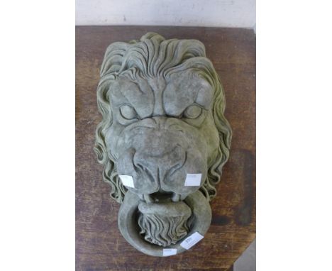 A concrete lion garden wall plaque 