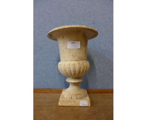 A miniature Victorian cast iron garden urn 