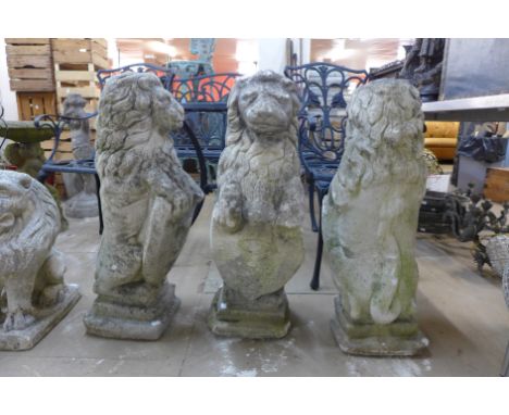 A set of three concrete heraldic lion garden figures 