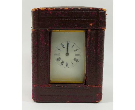 A miniature French carriage clock, in five glass brass case, the back stamped 'E.G.L. PARIS', 9cm high not including handle, 