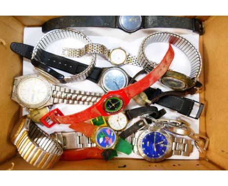 An assortment of modern wrist watches including seven Swatch examples, a Storm watch and six others CONDITION REPORTS & PAYME