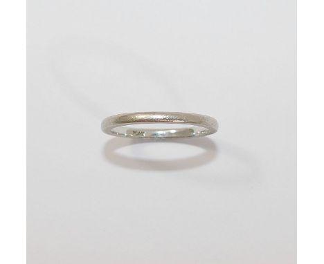 A plain platinum wedding band, finger size K, stamped 'PLAT', 2.8g CONDITION REPORTS & PAYMENT DETAILS IMPORTANT*  Descriptio