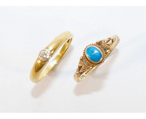 An 18 carat gold diamond single stone ring, the round brilliant cut stone approximately 0.13 carats, Birmingham 1995, finger 