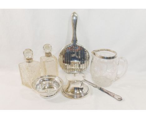 An Edwardian circular silver inkwell, Sheffield 1908 by Walker and Hall, with loaded base, 9.7cm diameter, a small silver bow