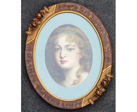 19th Century British, oval portrait of a young woman, oil on canvas, unsigned, 28cm x 20cm, within oval mount and later ornat