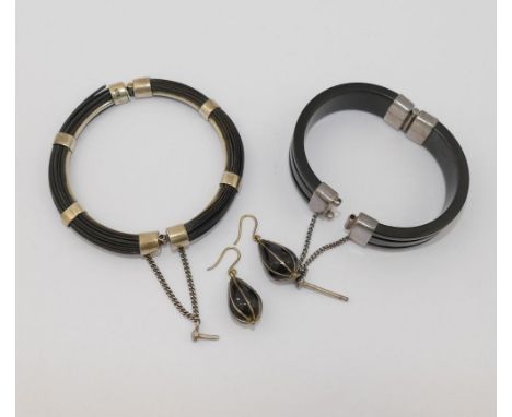 An elephant hair hinged bangle, the mounts stamped '925', 0.8cm wide x 7.5cm diameter, a hinged tortoiseshell bangle, the mou