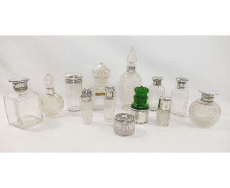 A collection of ten Victorian and later silver mounted cut and moulded glass scent bottles and toiletry jars, the tallest 16c