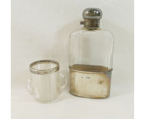 An early 20th century silver-mounted glass hip flask, London 1913, 15cm high, and a three handled glass match strike with sil