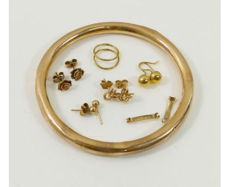 A 9ct gold hollow slave bangle, five pairs of yellow metal and 9 carat gold earrings and two other yellow metal items, combin