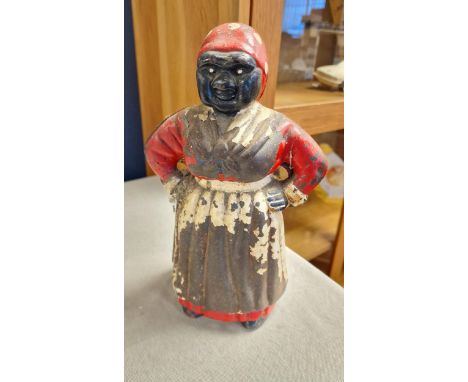 Cast Iron 'Mammy' Jolly Lady Money Box Notice from the the-saleroom.com: These items are listed on the basis they are illustr